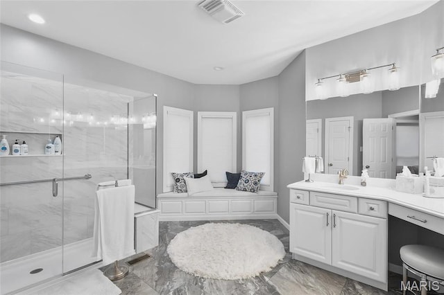 12537 Clark Manor Cir, Creve Coeur, MO 63141 - bathroom with marble tiled floors, a shower stall, vanity, and recessed lighting