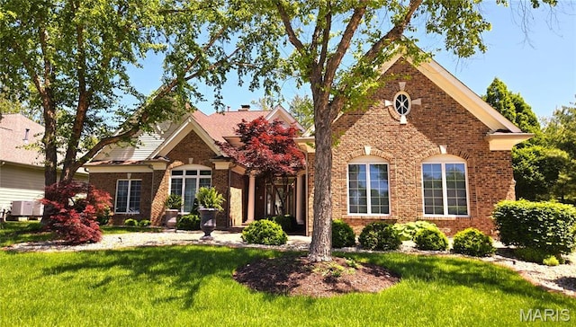 12537 Clark Manor Cir, Creve Coeur, MO 63141 - view of front of property featuring a front yard, brick siding, and central AC unit