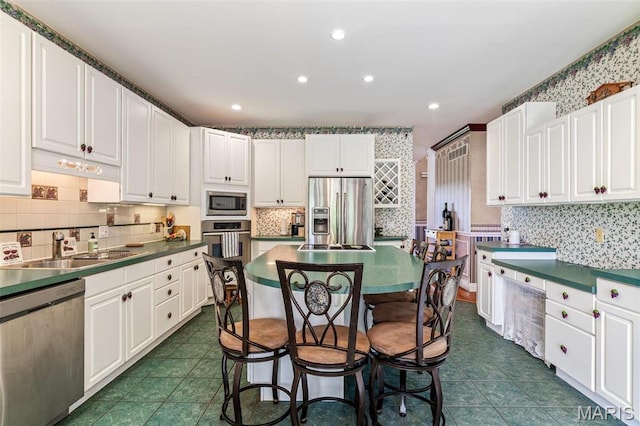 11400 State Road C, Hillsboro, MO 63050 - kitchen featuring stainless steel appliances, a sink, white cabinets, tasteful backsplash, and recessed lighting