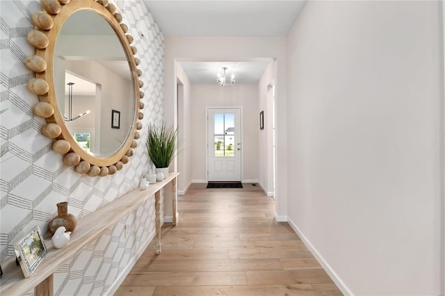 3248 River Breeze Ct, Saint Charles, MO 63301 - entryway with a chandelier, light wood-style flooring, and baseboards