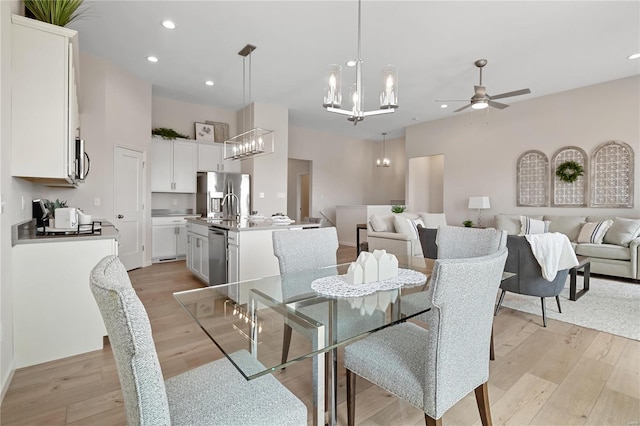 3248 River Breeze Ct, Saint Charles, MO 63301 - dining space featuring a chandelier, light wood-style floors, a ceiling fan, and recessed lighting