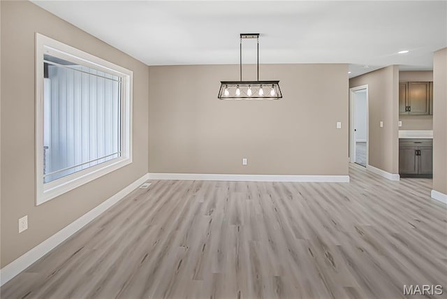 1002 Brianna Ct, Jerseyville, IL 62052 - unfurnished dining area featuring light wood-style floors and recessed lighting