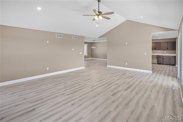 1002 Brianna Ct, Jerseyville, IL 62052 - unfurnished living room with a ceiling fan, lofted ceiling, light wood-style floors, and recessed lighting