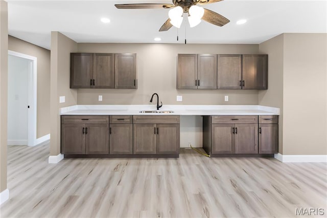 1002 Brianna Ct, Jerseyville, IL 62052 - kitchen with light wood-type flooring, ceiling fan, light countertops, and recessed lighting