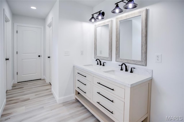 1002 Brianna Ct, Jerseyville, IL 62052 - full bath featuring double vanity, wood finished floors, and recessed lighting