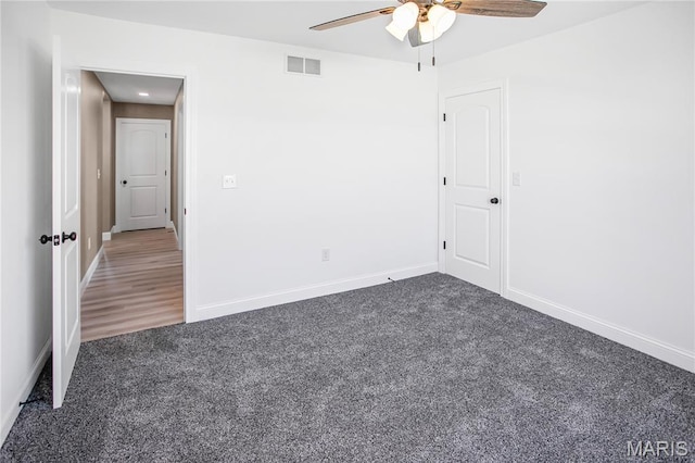 1002 Brianna Ct, Jerseyville, IL 62052 - empty room with dark colored carpet and a ceiling fan