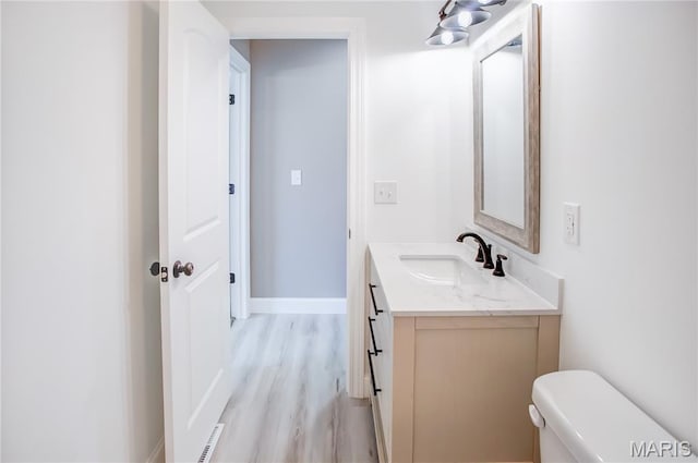 1002 Brianna Ct, Jerseyville, IL 62052 - half bath featuring vanity and wood finished floors