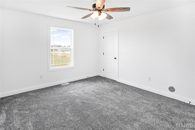 1002 Brianna Ct, Jerseyville, IL 62052 - empty room featuring a ceiling fan and dark colored carpet