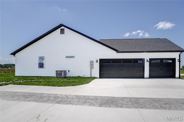 1002 Brianna Ct, Jerseyville, IL 62052 - view of property exterior with an attached garage, driveway, and a shingled roof