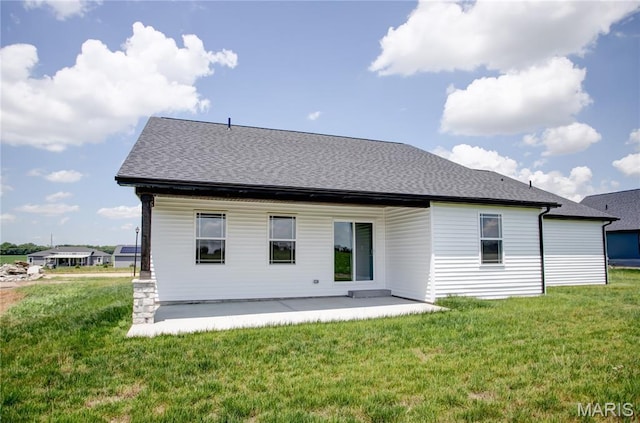 1002 Brianna Ct, Jerseyville, IL 62052 - rear view of house featuring a lawn and a patio area
