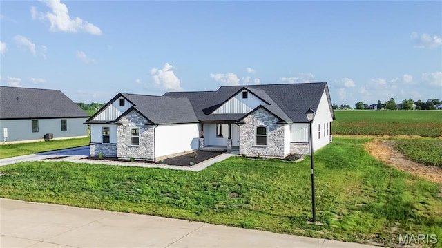 1002 Brianna Ct, Jerseyville, IL 62052 - modern inspired farmhouse featuring stone siding and a front yard