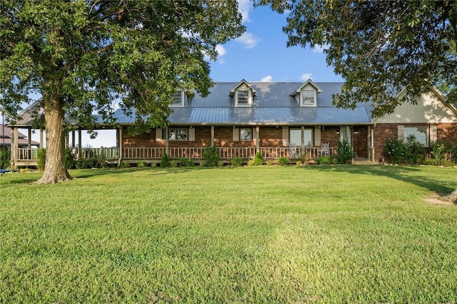 6492 State Highway 25, Dexter, MO 63841 - view of front of house with brick siding, a front lawn, and metal roof