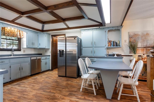 6492 State Highway 25, Dexter, MO 63841 - kitchen featuring stainless steel appliances, a sink, coffered ceiling, wood finished floors, and dark countertops