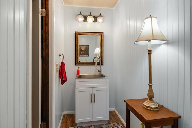 6492 State Highway 25, Dexter, MO 63841 - hall with a sink, dark wood finished floors, and baseboards