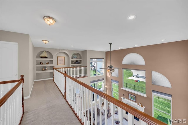 1101 Panda Ct, Wentzville, MO 63385 - hall featuring an upstairs landing, carpet flooring, healthy amount of natural light, built in features, and recessed lighting