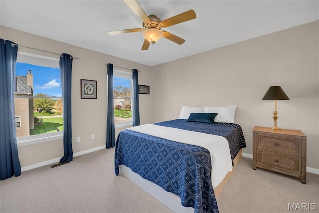 1101 Panda Ct, Wentzville, MO 63385 - bedroom with light carpet, baseboards, and a ceiling fan