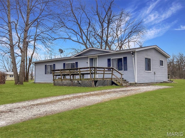 307 Silvey, Fayette, MO 65248 - view of front of property with a front lawn, a deck, and driveway