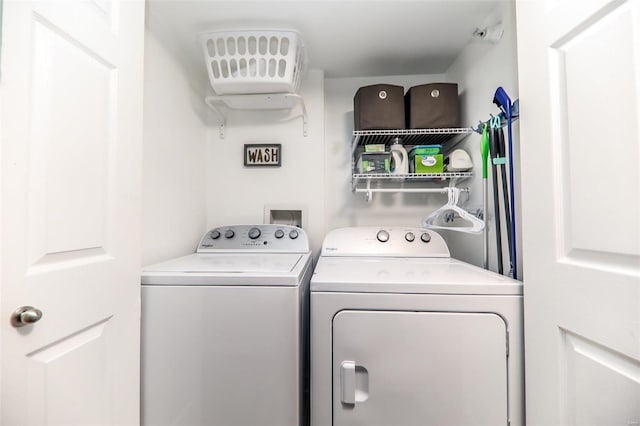 clothes washing area with independent washer and dryer
