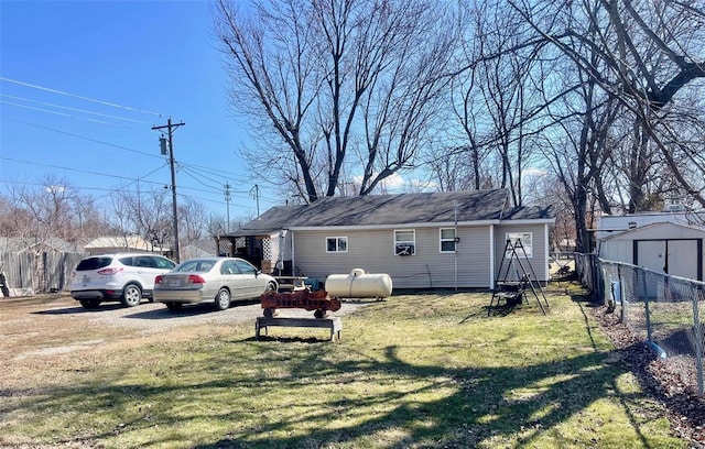 659 W 4th St, Lebanon, MO 65536 - view of side of home with a storage unit and an outdoor structure
