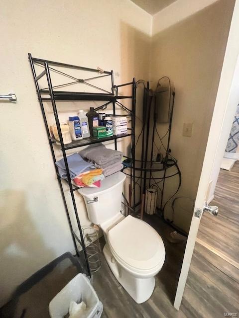 659 W 4th St, Lebanon, MO 65536 - bathroom featuring wood finished floors and toilet