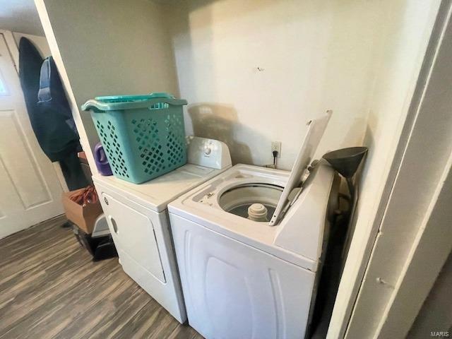 659 W 4th St, Lebanon, MO 65536 - washroom with washing machine and dryer and dark wood finished floors