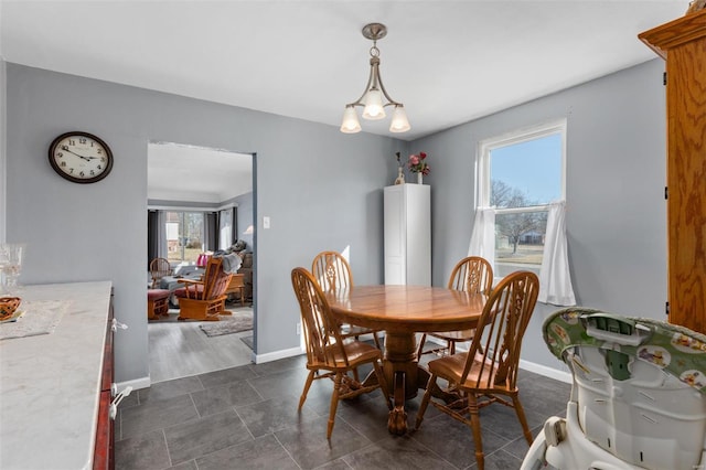 dining room featuring baseboards