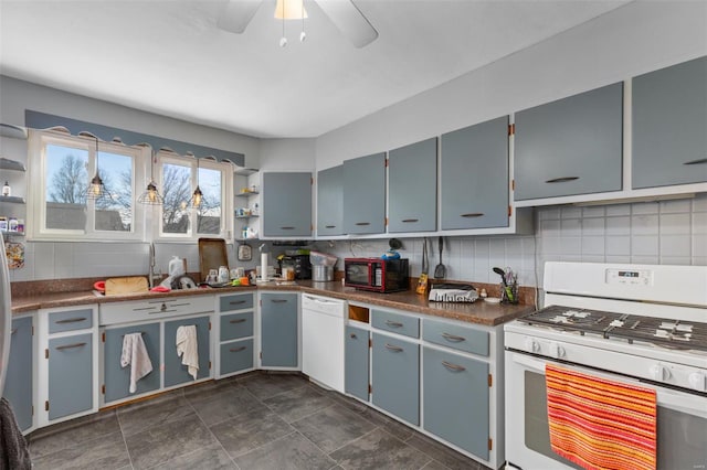 kitchen with white appliances, open shelves, dark countertops, and tasteful backsplash