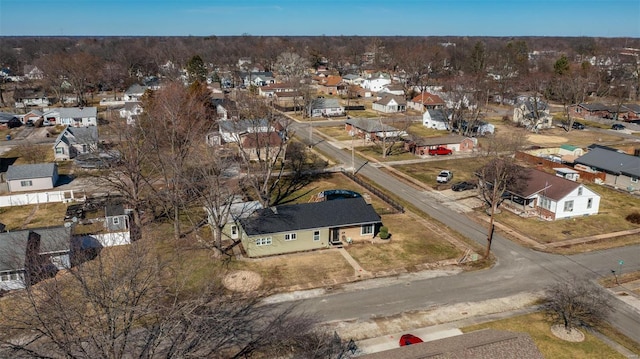 aerial view of property and surrounding area featuring nearby suburban area