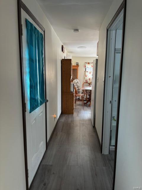 hall with wood finished floors