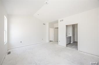 7301 Providence Dr, Edwardsville, IL 62025 - unfurnished bedroom with vaulted ceiling, a closet, and ensuite bathroom