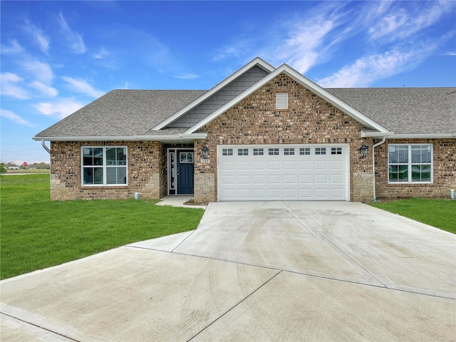 624 Rhapsody, Troy, IL 62294 - view of front of property with roof with shingles, concrete driveway, an attached garage, a front lawn, and brick siding