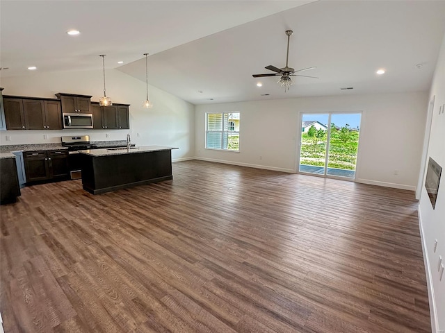 624 Rhapsody, Troy, IL 62294 - kitchen featuring appliances with stainless steel finishes, a sink, open floor plan, vaulted ceiling, and dark wood-style flooring