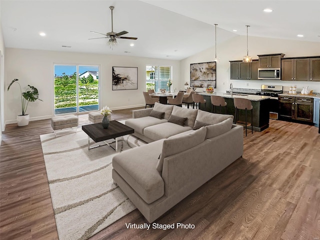 624 Rhapsody, Troy, IL 62294 - living room featuring lofted ceiling, healthy amount of natural light, baseboards, wood finished floors, and ceiling fan