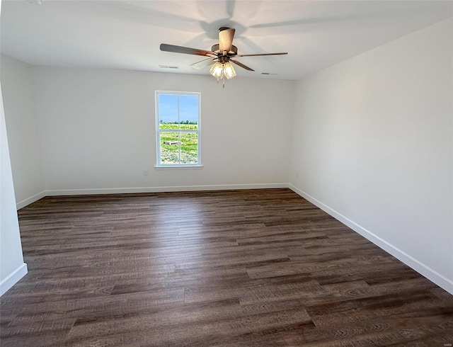 624 Rhapsody, Troy, IL 62294 - unfurnished room with a ceiling fan, baseboards, and dark wood-type flooring