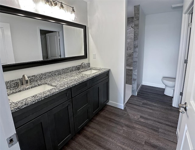 624 Rhapsody, Troy, IL 62294 - full bathroom with toilet, wood finished floors, tiled shower, double vanity, and baseboards