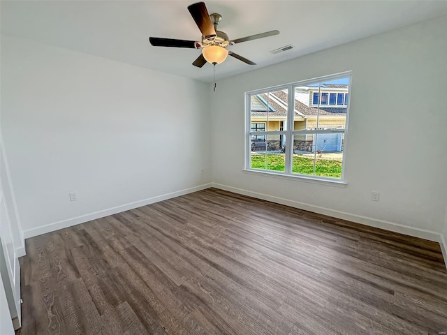 624 Rhapsody, Troy, IL 62294 - unfurnished room with dark wood-type flooring, baseboards, and a ceiling fan