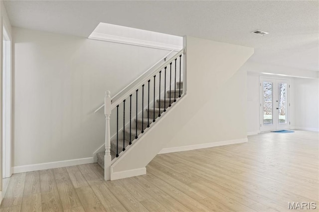 3216 E Leverett Ct, Alton, IL 62002 - staircase featuring wood finished floors, baseboards, and french doors