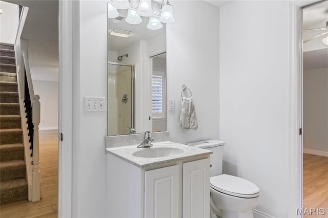 3216 E Leverett Ct, Alton, IL 62002 - bathroom featuring wood finished floors, vanity, an enclosed shower, and toilet