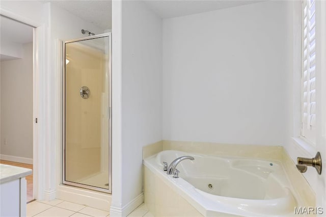 3216 E Leverett Ct, Alton, IL 62002 - bathroom with a stall shower, a whirlpool tub, tile patterned floors, and vanity