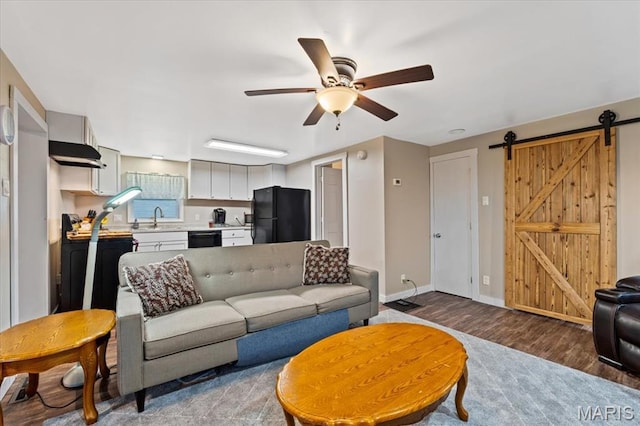 6405 S Ronnie Dr, Waterloo, IL 62298 - living room with ceiling fan, a barn door, and wood finished floors