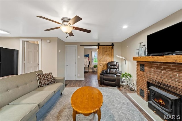 6405 S Ronnie Dr, Waterloo, IL 62298 - living room with a barn door, wood finished floors, a ceiling fan, and recessed lighting