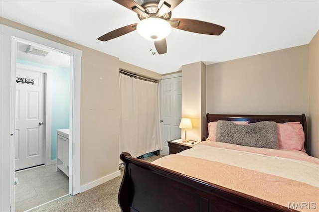 6405 S Ronnie Dr, Waterloo, IL 62298 - bedroom featuring a closet, a ceiling fan, connected bathroom, and light carpet