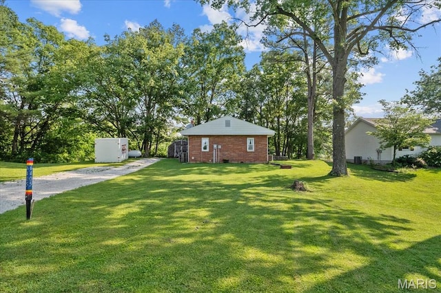 6405 S Ronnie Dr, Waterloo, IL 62298 - view of green lawn featuring gravel driveway