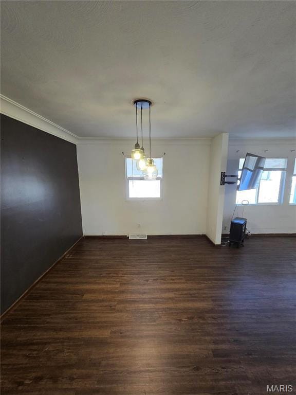 423 Virginia St, Granite City, IL 62040 - unfurnished dining area featuring dark wood-style flooring and ornamental molding