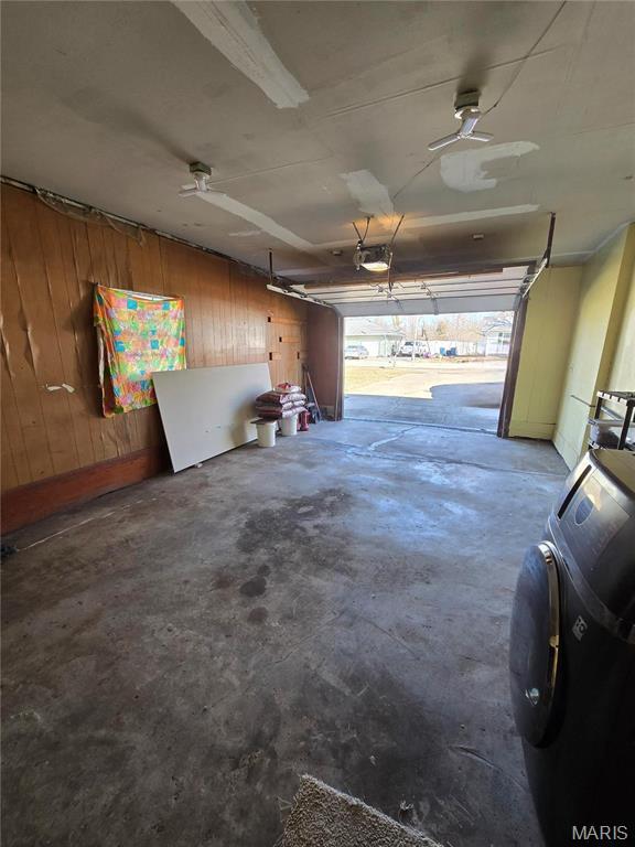 423 Virginia St, Granite City, IL 62040 - garage with a garage door opener and wooden walls
