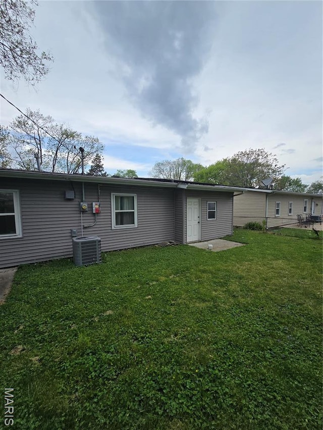 4536 Walter Ave, Granite City, IL 62040 - rear view of property with a lawn and cooling unit