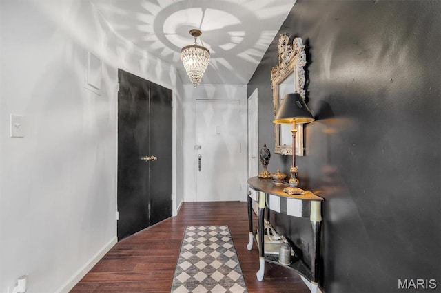 4466 W Pine Blvd Unit 8E, Saint Louis, MO 63108 - hall with a chandelier and wood finished floors