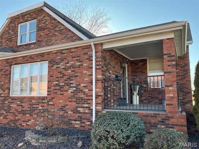 550 N 4th St, Breese, IL 62230 - view of property exterior featuring brick siding and covered porch