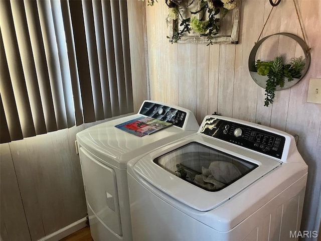 550 N 4th St, Breese, IL 62230 - laundry area with washing machine and dryer and wood walls