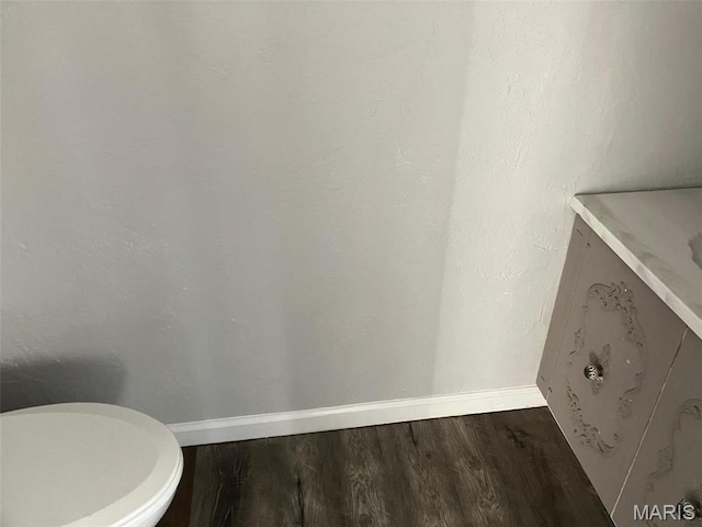 550 N 4th St, Breese, IL 62230 - bathroom featuring wood finished floors, baseboards, vanity, and toilet